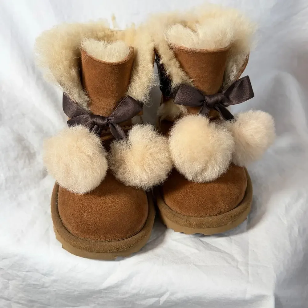 UGG Toddler Gita chestnut boots.  Front bow pom-poms.  Size 8T. Worn once